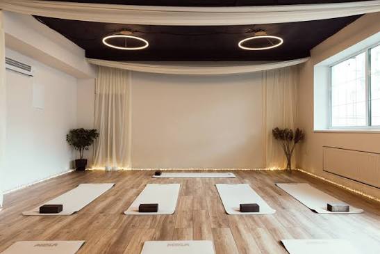 Guided meditation and restorative yoga session at StillRoot Yoga